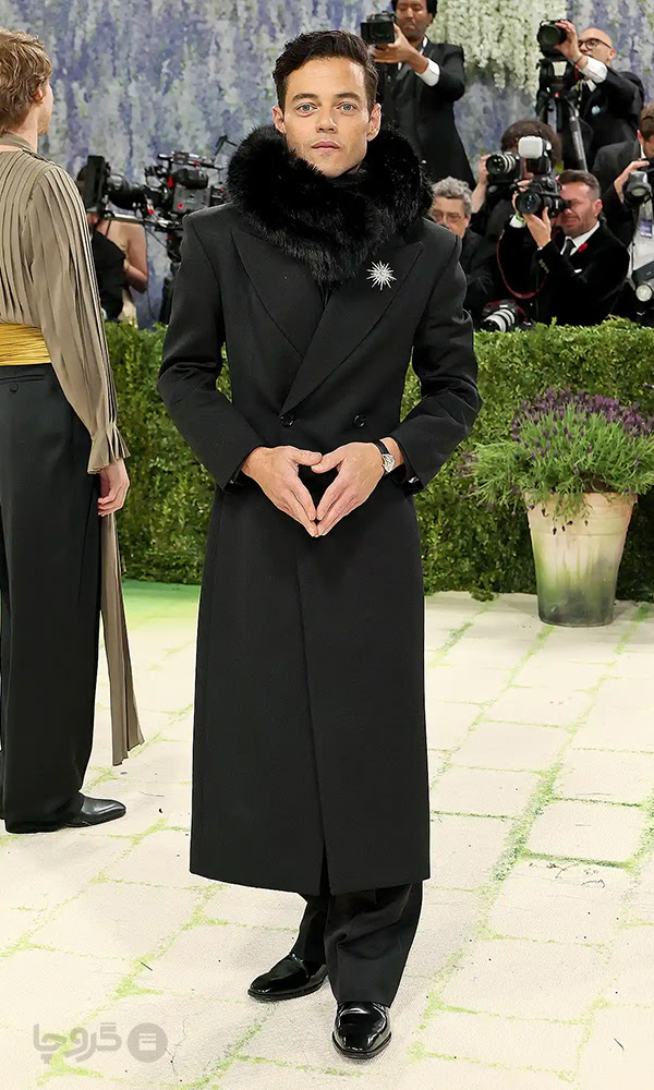 Rami Malek mannequin-style Met Gala 2026 formal red carpet fashion portrait